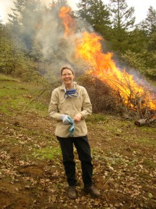 Jeanie Taylor burning scotch broom and materials left over from thinning
